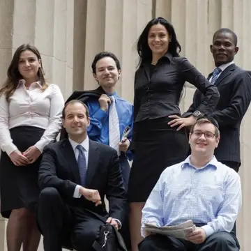 Six Touro Business students in front of financial hub in New York
