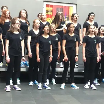 Pictured here is our Fourteeners Ensemble Choir singing on tour in Summer 2019.