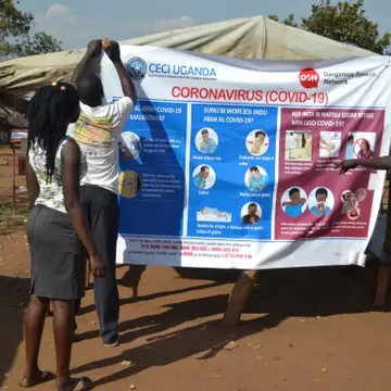 CECI Uganda distributing covid-19 awareness banners created in local languages to public places in Bidibidi Refugee Settlement with support from the Dangerous Speech Network and the Wellsprings Philanthropy Fund__