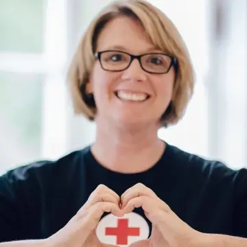 Woman in Red Cross t shirt