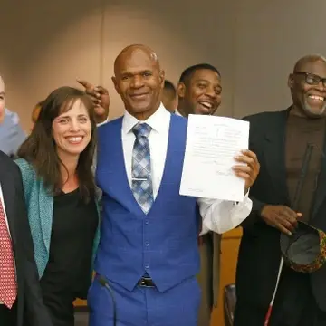 Dennis Allen & Stanley Mosey celebrating with their attornies