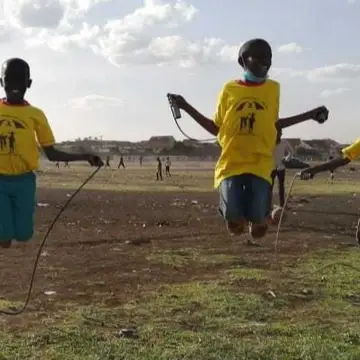 Smile children rope skipping at Jacaranda grounds which is a walking distance from our home in soweto slums