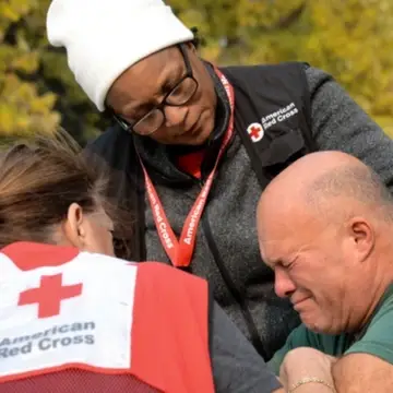 Red Cross volunteers providing emotional comfort.