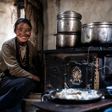 Loba woman in Mustang prepares traditional Tibetan meal