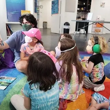 educator reading to kiddos