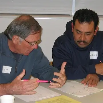 Image: Volunteer tutor and adult learner studying together