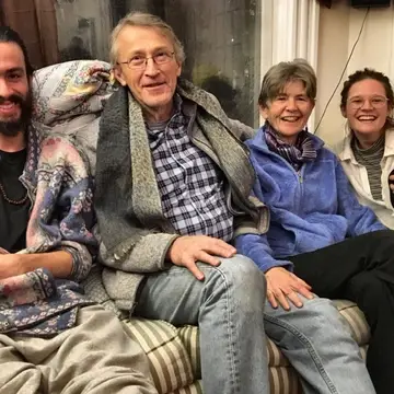 Two QVS Fellows sitting on a couch with their Spiritual Nurturers.