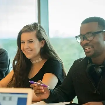 Students gathered around a table