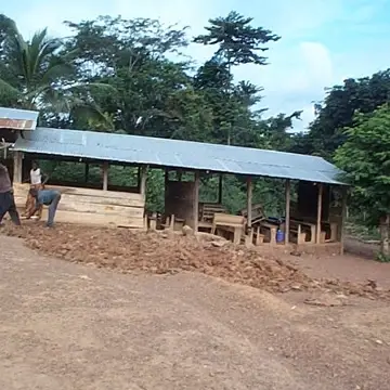 Working with the community to put up a temporary structure for school children in Ghana