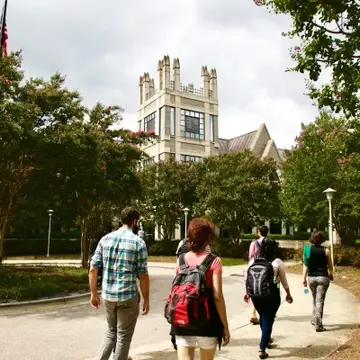 Students walk toward the Sanford building.