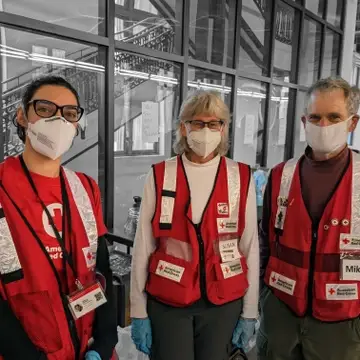 Three Red Cross Volunteers at a warming shelter in Denver during 2022
