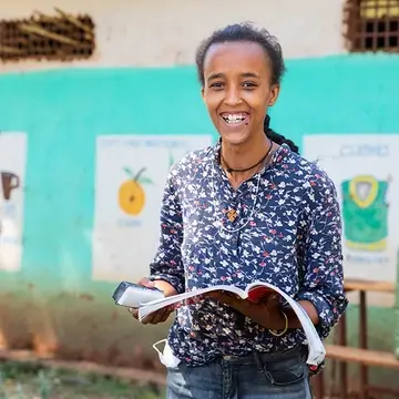 Luminos Second Chance teacher Lominas outside her classroom in Ethiopia