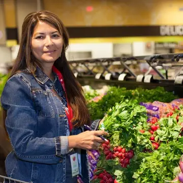 Volunteer grocery shopper picking produce