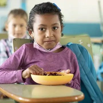 Child Eating School Lunch