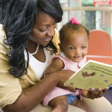 Mom reading to baby