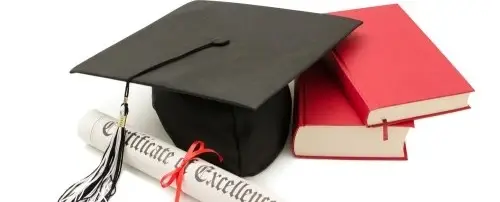 A graudate cap next to a diploma.