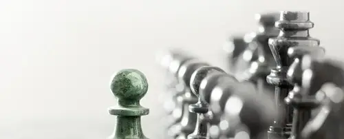 Chess pieces with the rival pawn up front.