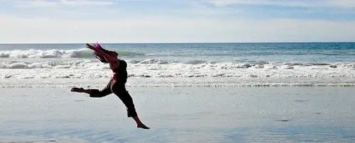 Someone jumping at the beach.