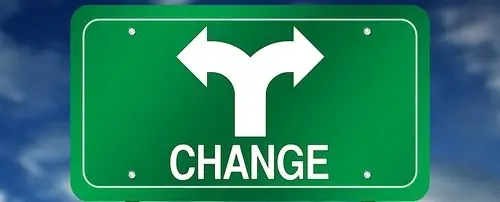 A traffic sign that points in two directions and says, "change."