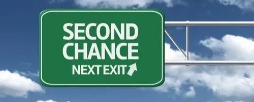 A road sign that says 'Second Chance Next Exit'