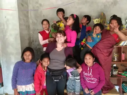 Volunteer teaching English to children from native communities of the Peruvian Andes