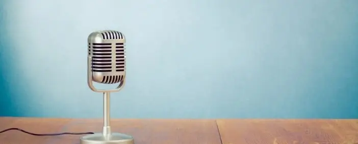 A vintage microphone on a desk.