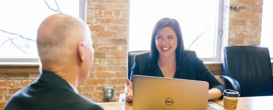 woman and man in office meeting