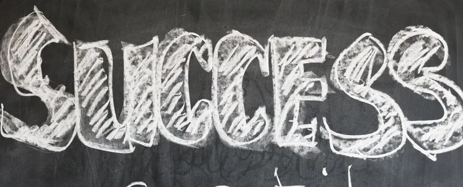 The word success on a chalkboard.