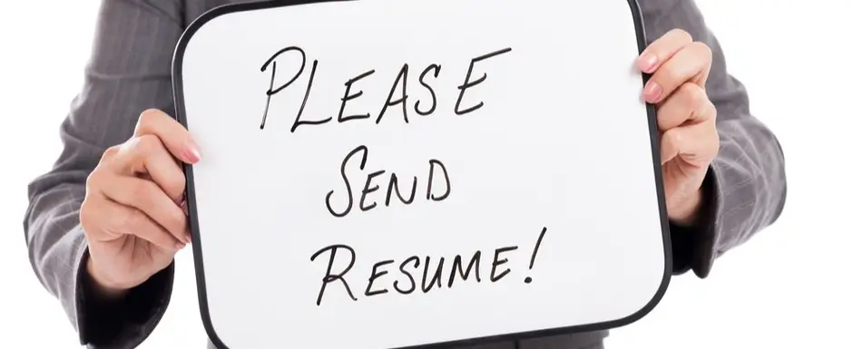 A person holding a whiteboard that says 'Please Send Resume!'.