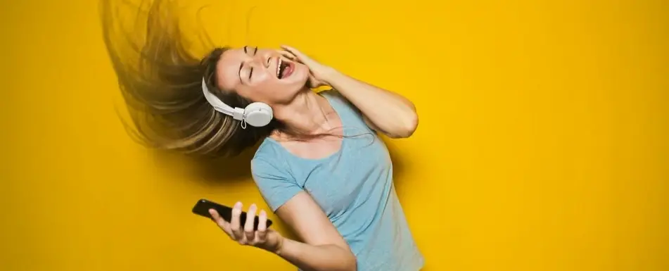 A person with headphones dancing.