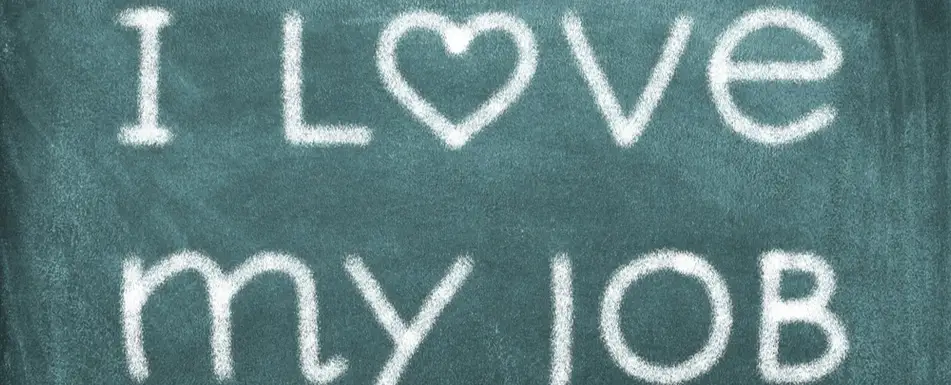 A chalkboard that says 'I love my job.'