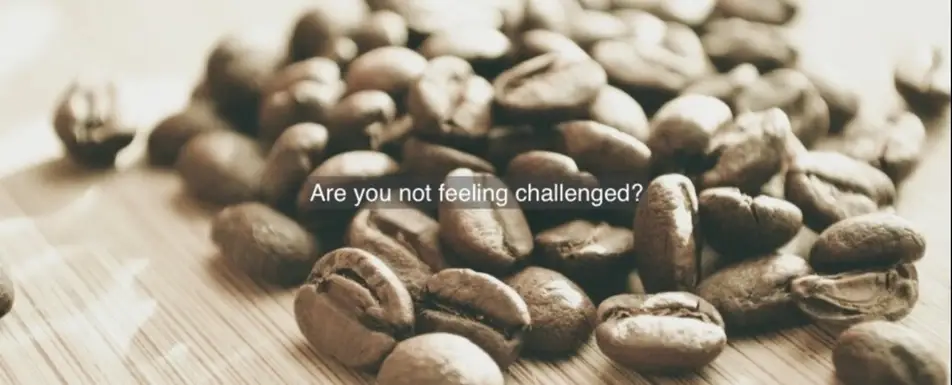 A picture of coffee beans with an overlay of an inspirational quote.