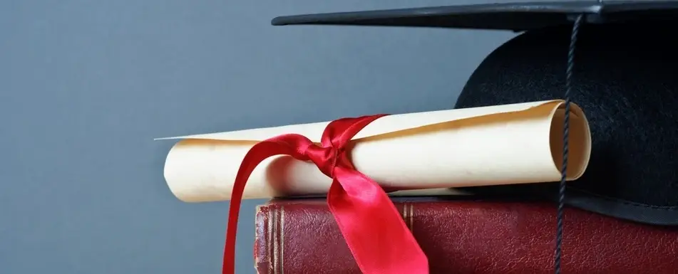A close up of a rolled up diploma.