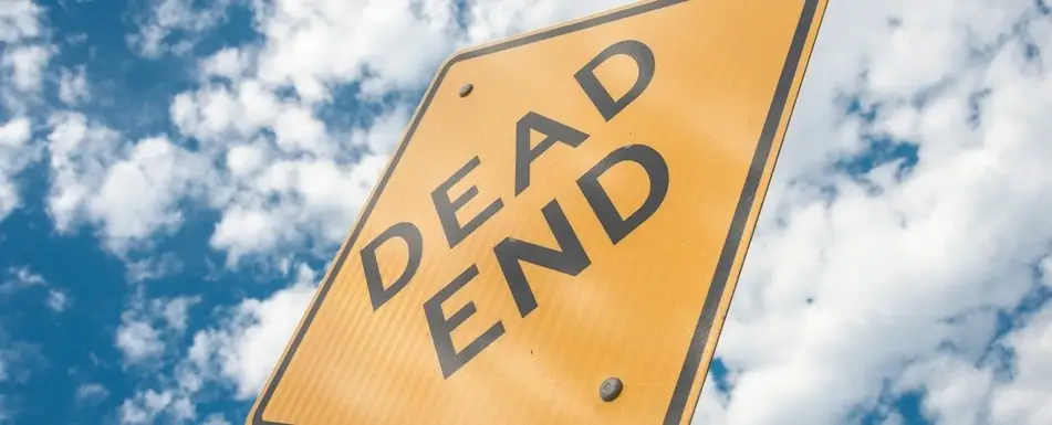 A Dead End road sign.