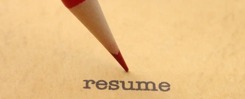 A piece of paper that says, "Resume" on it.