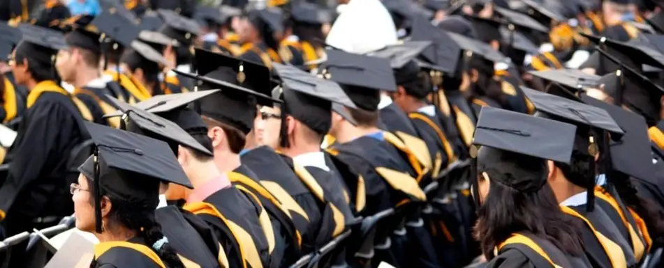 A group of graduate students in their robes and caps.