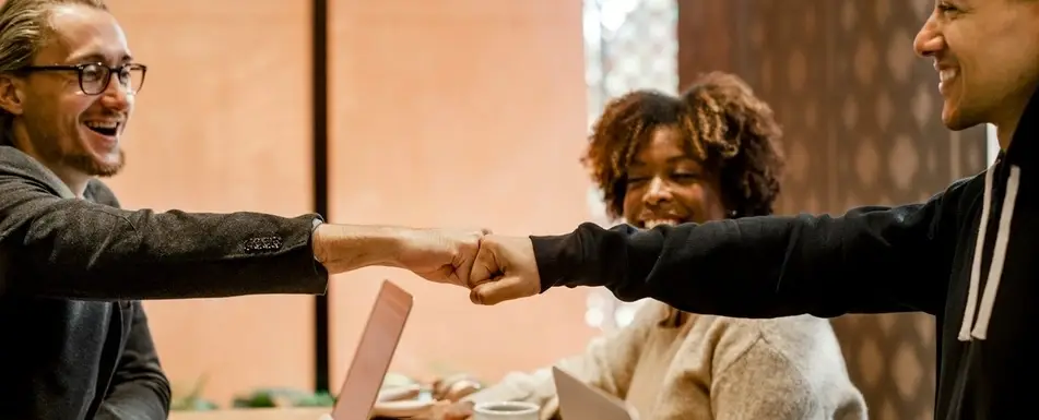 Two men fist bumping.