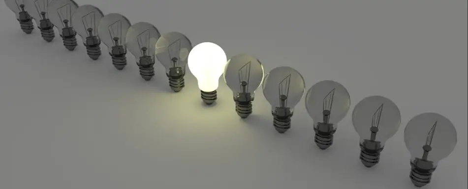 A line of light bulbs, only one is lit.