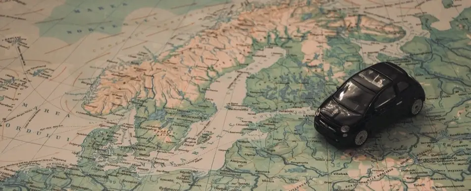 A small toy car on a map.