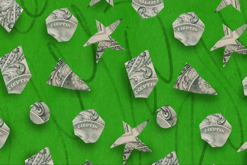 An image with different shapes cut out of a one dollar bill.