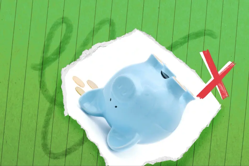 Image with an upside down piggy bank and an x