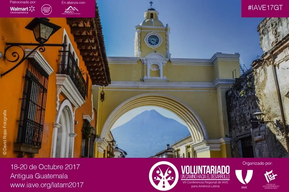 Afiche del evento con un paisaje de Guatemala