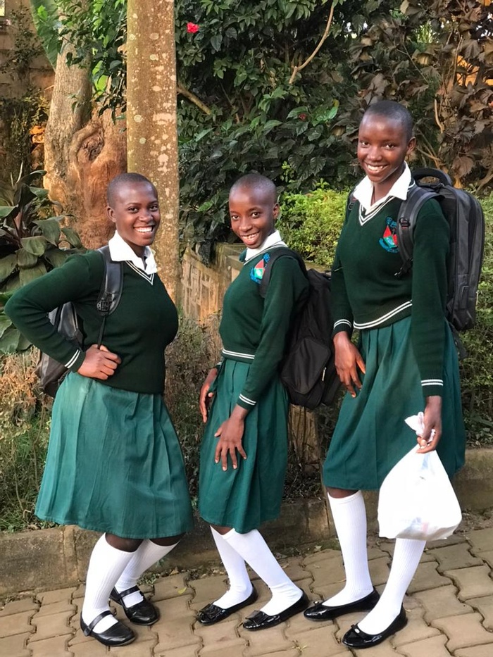 Angella, Nakassi and Future very happy as they go to school