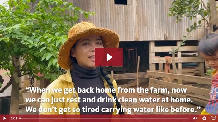 video thumbnail of women in front of rural wooden house