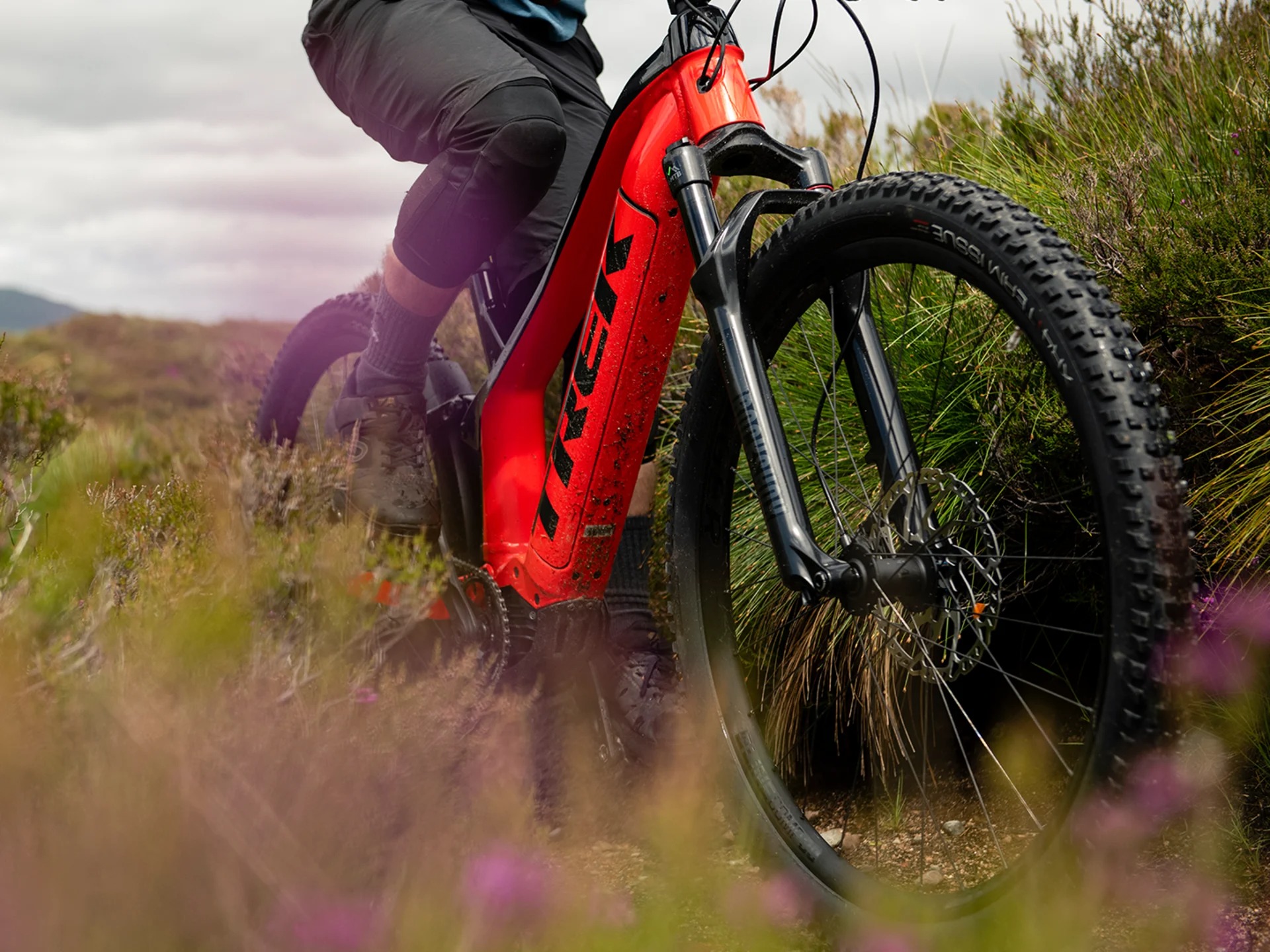 Trek red e-bike off road