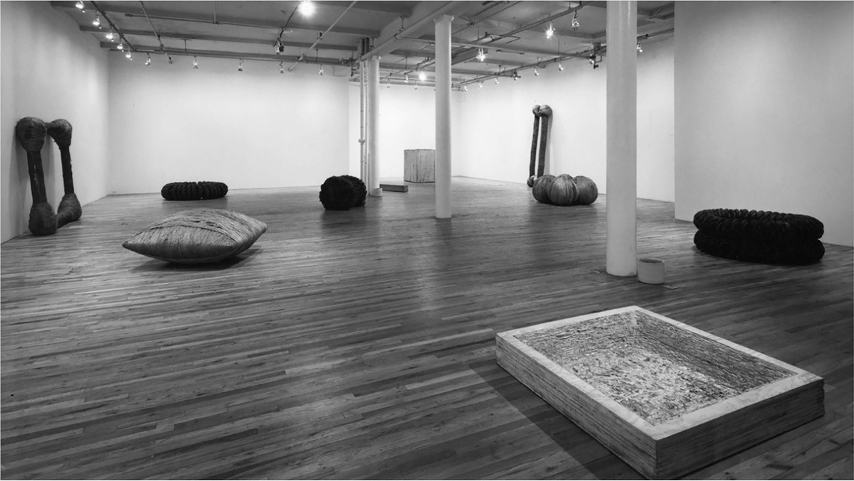Black and white photo of Jackie Winsor's solo exhibition at Paula Cooper Gallery
