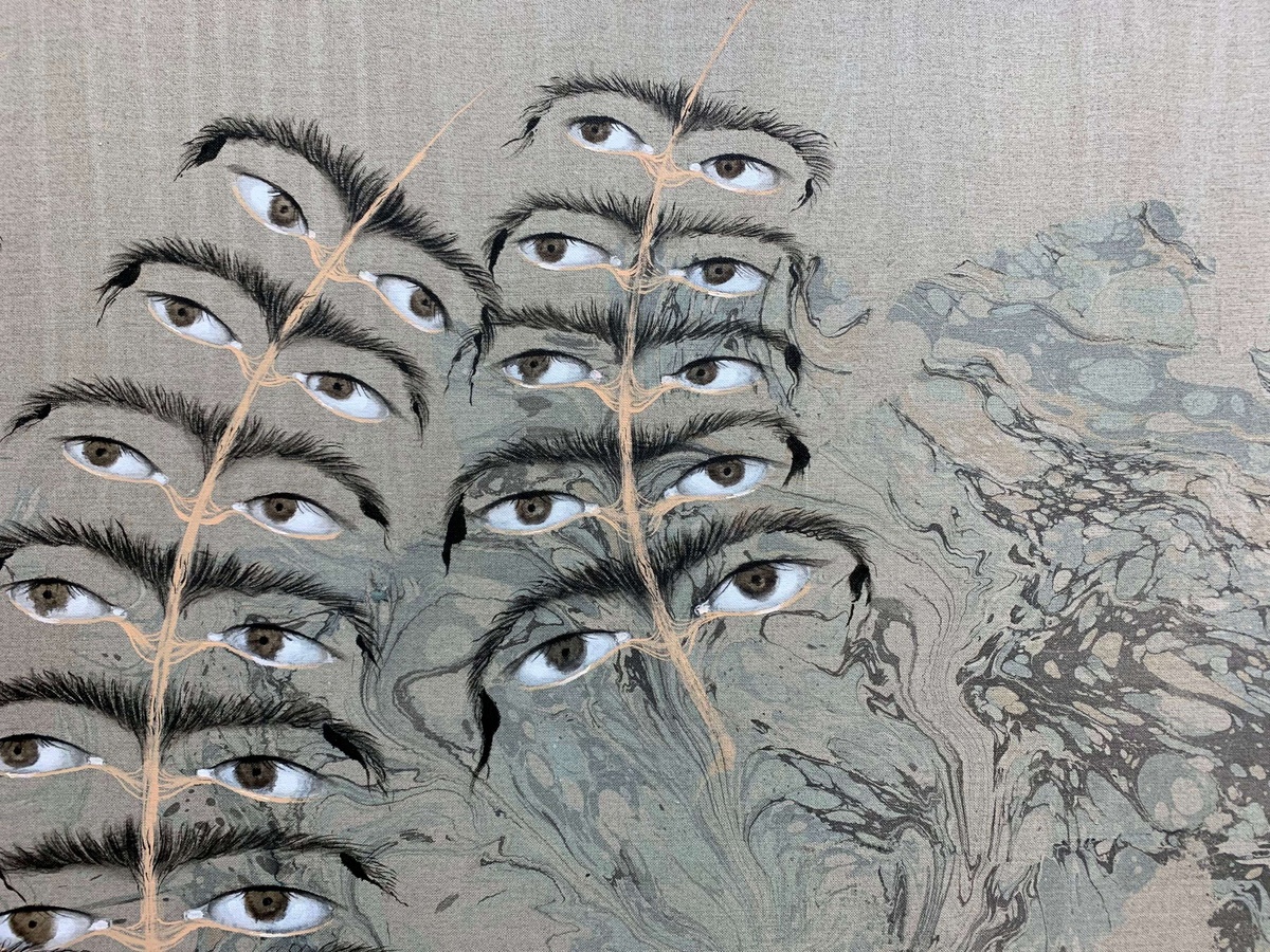 Two fern-like stems sprout pairs of eyes and eyebrows. The background is a raw, gray-beige linen, with blue and gray marbling covering the bottom righthand section of the painting.
