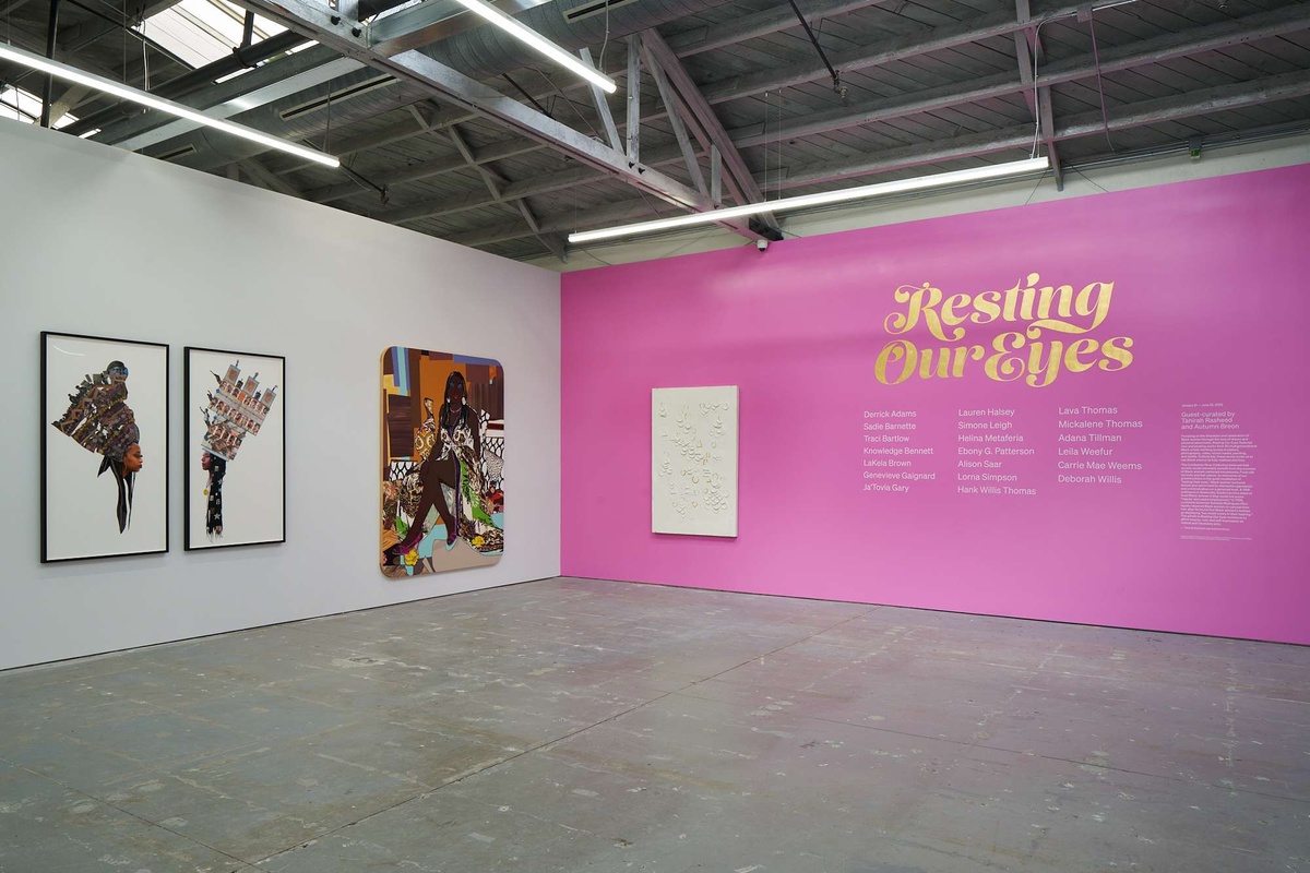 Installation view of pink Resting Our Eyes title wall
