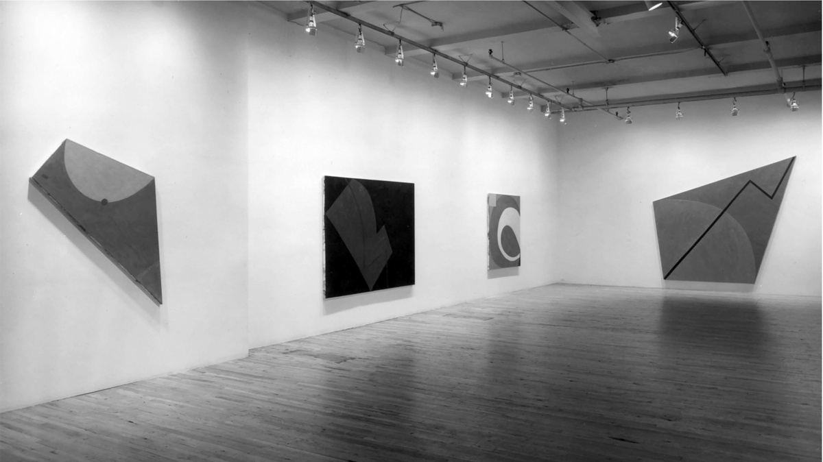 Black and white photo of four Elizabeth Murray paintings on view at Paula Cooper Gallery