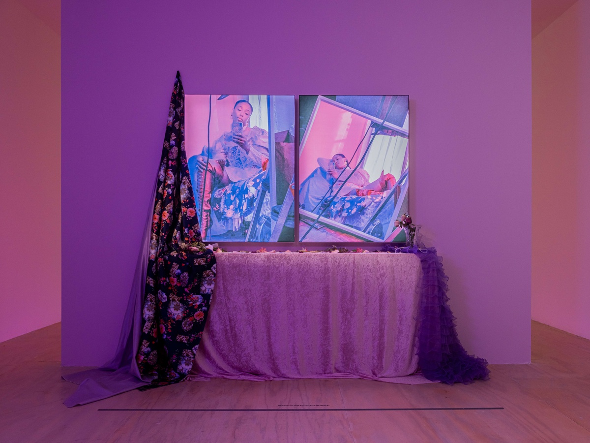 E. Jane, co-directing a music video I + II, 2020, selfie diptych in still life installation, including two lightbox prints, fabric, etched glass vase, dried flowers, pearls, gemstones, bows, and wood.
